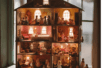Many dolls in a dollhouse