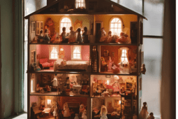 Many dolls in a dollhouse