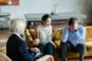 A couple arguing on a couch with a therapist watching | Photo by Timur Weber/Pexels