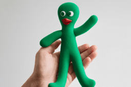 Hand holding Gumby doll