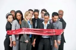 A group of people surrounded by red tape