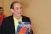 Rich holding an old issue of the magazine