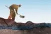 An illustration of a figure digging with a shovel