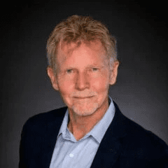 man in blue shirt and suit jacket