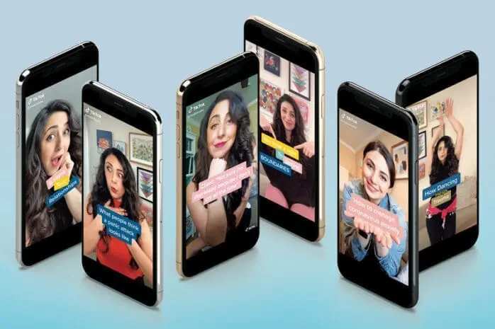 iPhones with photos of a woman on the screens