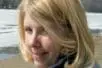 A headshot of a woman