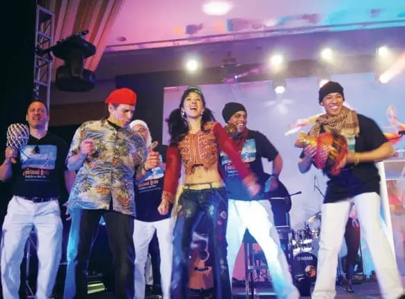 People dancing and singing onstage