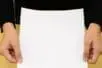 Hands holding a blank piece of paper