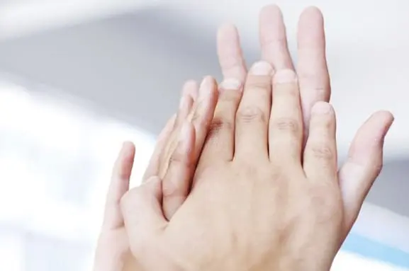 Hands holding each other
