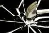 A hammer breaking glass