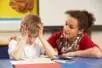 A teacher helping a frustrated student