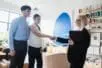 Therapist shaking hands with couple client