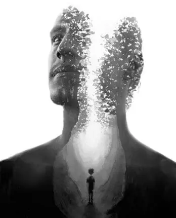 A man's head divided by light with a small boy at the base of his chest