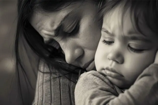 Mother and child embrace
