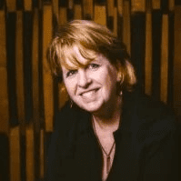 woman with red hair smiling