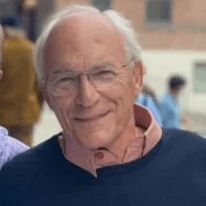 Man with glasses smiling